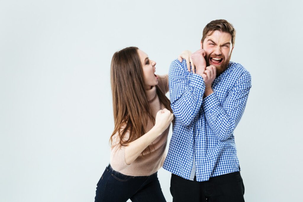 graphicstock-mad-aggressive-young-woman-shouting-and-fighting-with-her-husband-over-white-background_S_lxW0pI2x