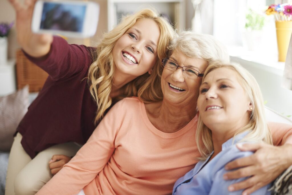 storyblocks-blonde-girl-taking-selfie-with-mom-and-grandma_HbeZQ4Awqz