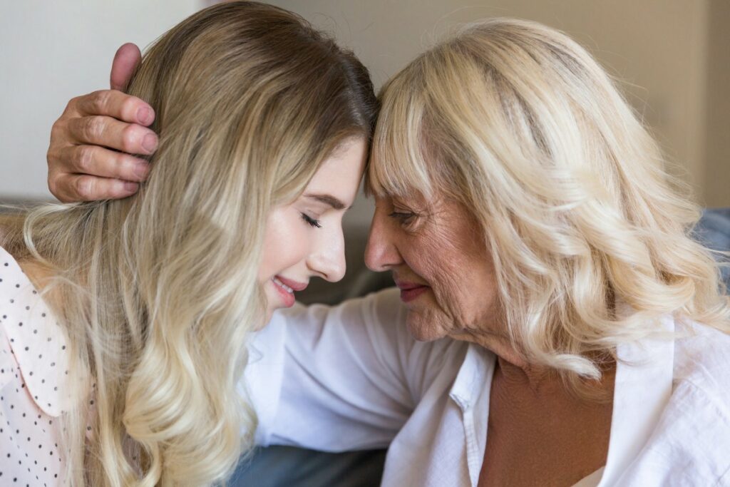 storyblocks-close-up-of-senior-grandmother-embracing-her-granddaughter-with-eyes-closed-indoors_BRMV073pcZ